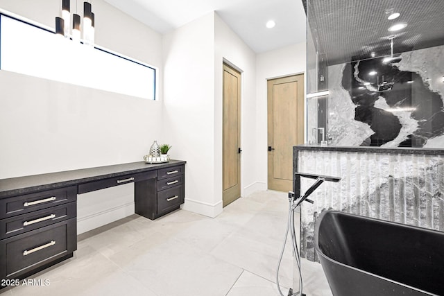 bathroom with recessed lighting, a freestanding tub, baseboards, and a shower stall