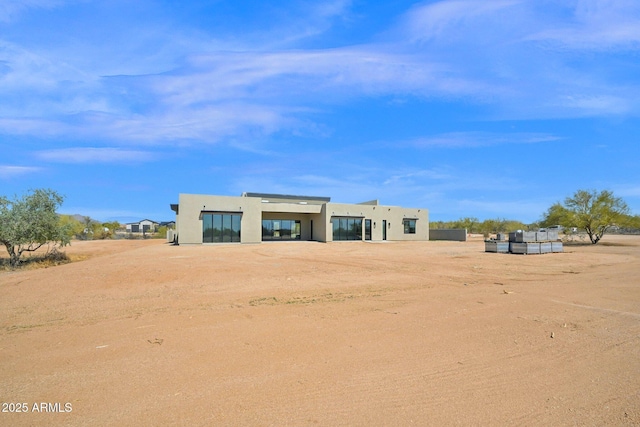 exterior space featuring stucco siding