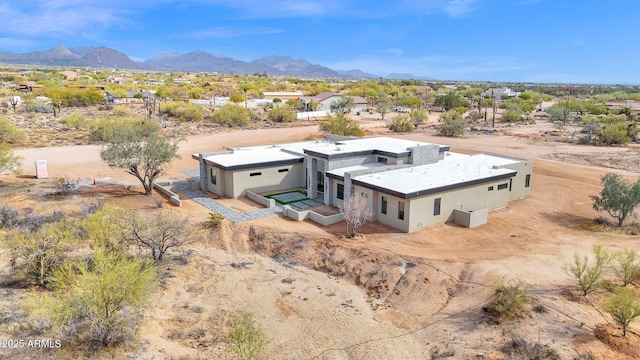 bird's eye view with view of desert and a mountain view