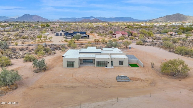 aerial view with a mountain view and a desert view