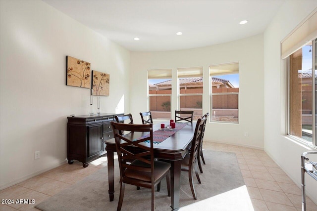 tiled dining room with plenty of natural light