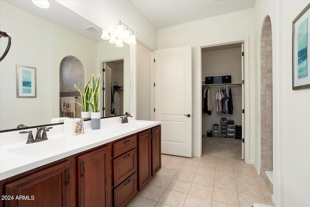 bathroom with tile patterned flooring and vanity