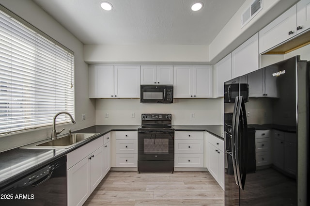 615 E Portland St Unit 261, Phoenix, AZ 85004 - kitchen with black appliances, white cabinets, and recessed lighting