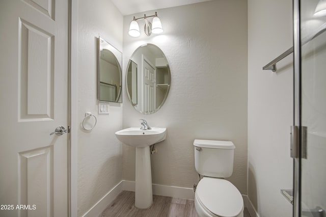 615 E Portland St Unit 261, Phoenix, AZ 85004 - bathroom with toilet and wood finished floors