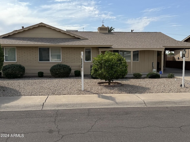 ranch-style house with a carport