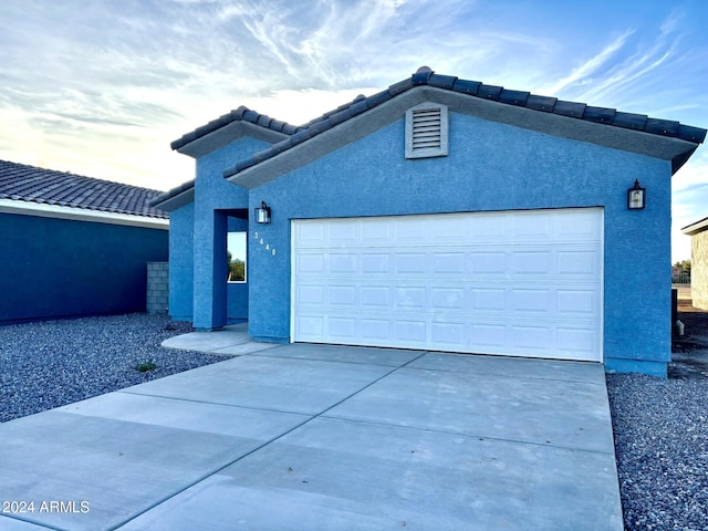 view of front of property featuring a garage