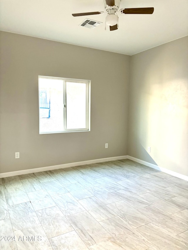 spare room featuring ceiling fan