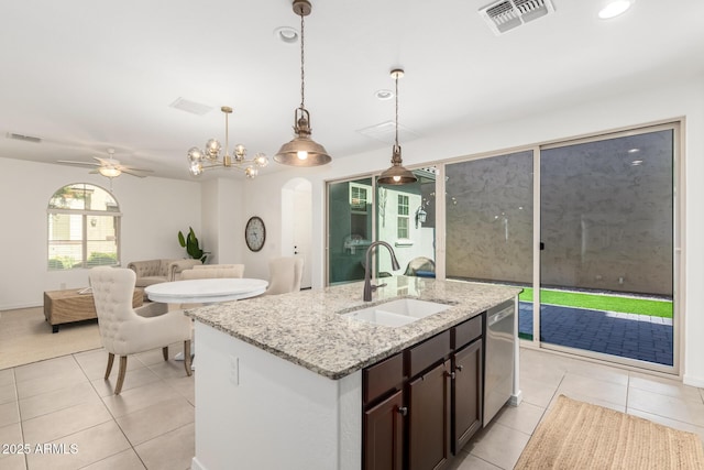 3910 E Turley St, Gilbert, AZ 85295 - kitchen featuring a sink, dishwasher, light tile patterned floors, open floor plan, and hanging light fixtures