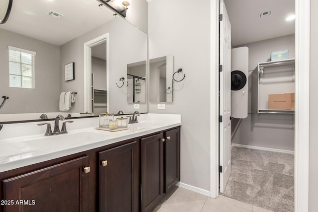 3910 E Turley St, Gilbert, AZ 85295 - full bathroom featuring double vanity, a spacious closet, tile patterned floors, and baseboards