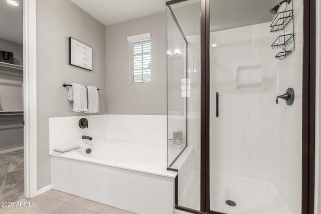 3910 E Turley St, Gilbert, AZ 85295 - full bath with a stall shower, a garden tub, a spacious closet, tile patterned floors, and baseboards