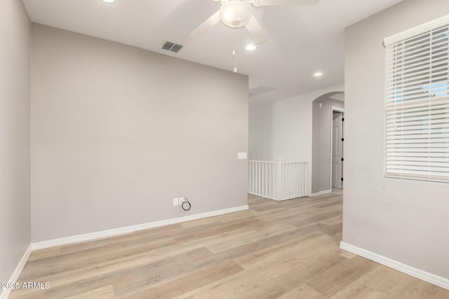 3910 E Turley St, Gilbert, AZ 85295 - empty room with arched walkways, a ceiling fan, recessed lighting, light wood-style floors, and baseboards