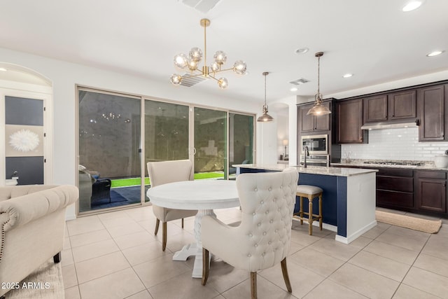 3910 E Turley St, Gilbert, AZ 85295 - dining room featuring light tile patterned floors, recessed lighting, and a chandelier