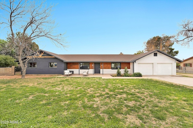 ranch-style house featuring a garage, a front yard, fence, and driveway