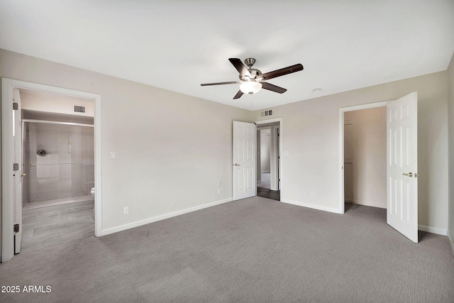 unfurnished bedroom featuring carpet, visible vents, and baseboards