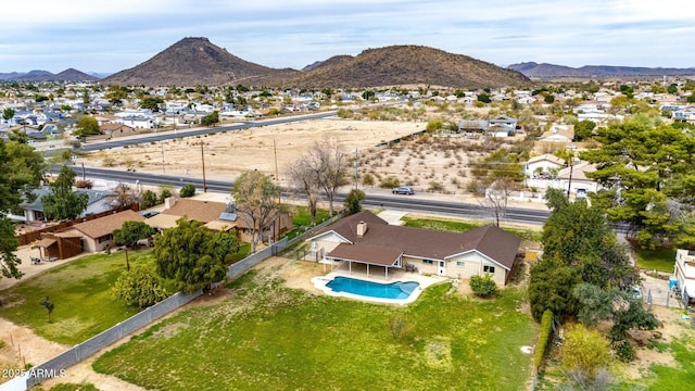 birds eye view of property with a residential view and a mountain view