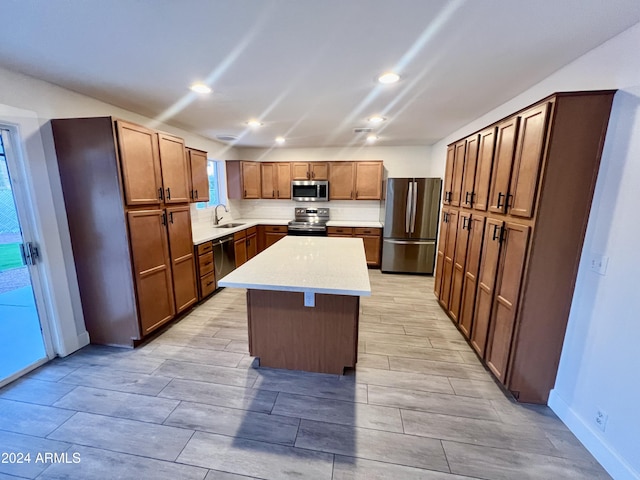 1737 N Trevor Dr, Mesa, AZ 85201 - kitchen featuring stainless steel appliances, a sink, a kitchen island, recessed lighting, and baseboards