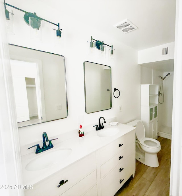 1737 N Trevor Dr, Mesa, AZ 85201 - full bathroom with wood finished floors, toilet, double vanity, and a shower