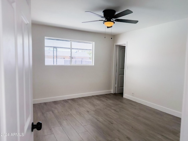 1737 N Trevor Dr, Mesa, AZ 85201 - empty room featuring wood finished floors, ceiling fan, and baseboards