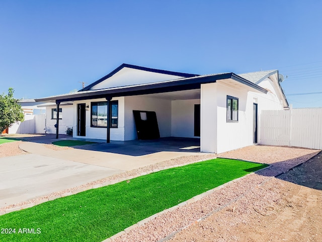 1737 N Trevor Dr, Mesa, AZ 85201 - single story home featuring a carport, fence, driveway, and stucco siding