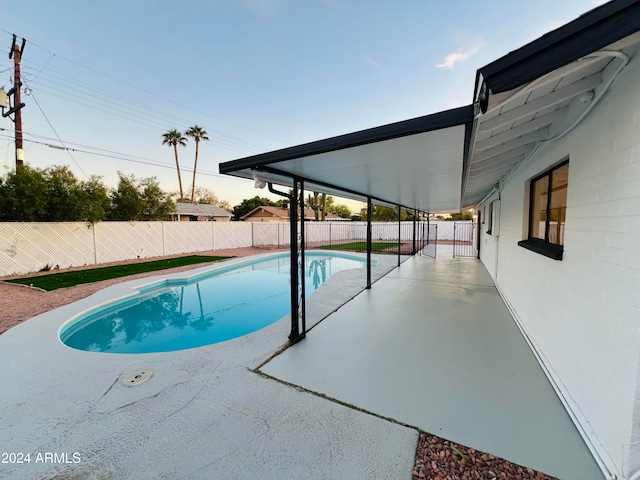 view of swimming pool featuring a patio