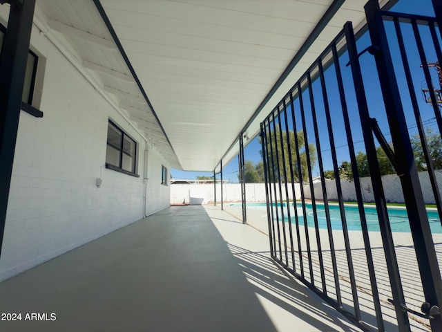 view of swimming pool with a patio area