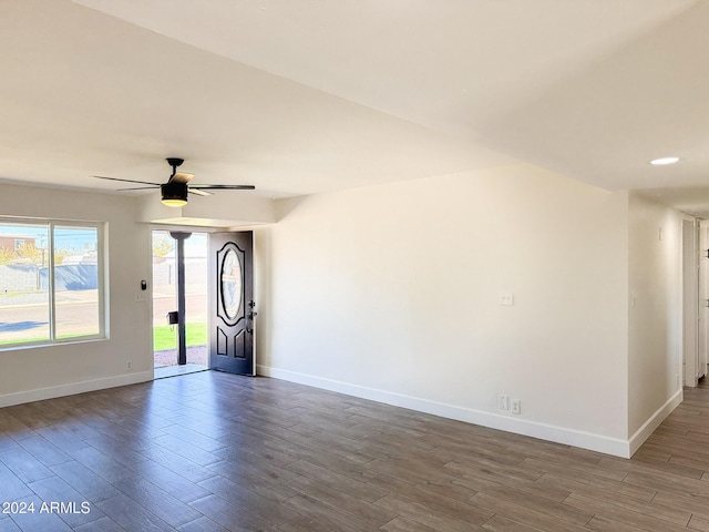 spare room featuring wood-type flooring and ceiling fan