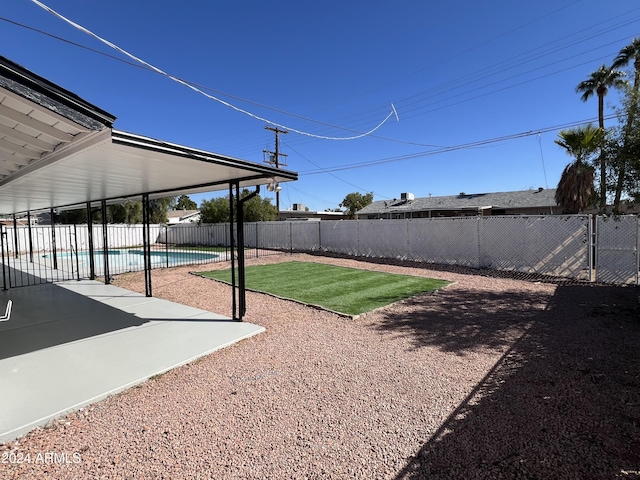 1737 N Trevor Dr, Mesa, AZ 85201 - fenced backyard with a patio