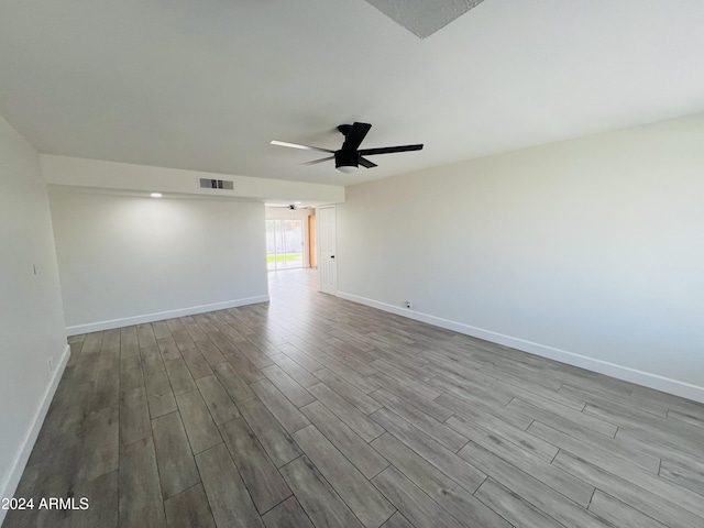1737 N Trevor Dr, Mesa, AZ 85201 - unfurnished room featuring wood finished floors, a ceiling fan, and baseboards