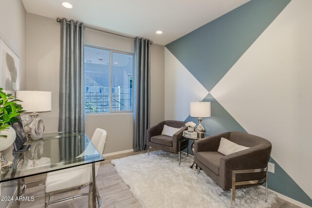 office featuring baseboards, wood finish floors, and recessed lighting