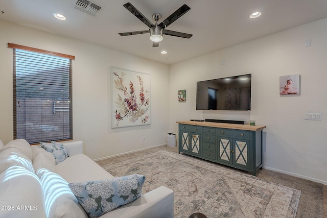 carpeted living room with visible vents, a ceiling fan, baseboards, and recessed lighting