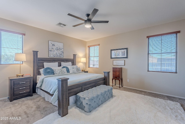 bedroom with visible vents, baseboards, ceiling fan, and light colored carpet