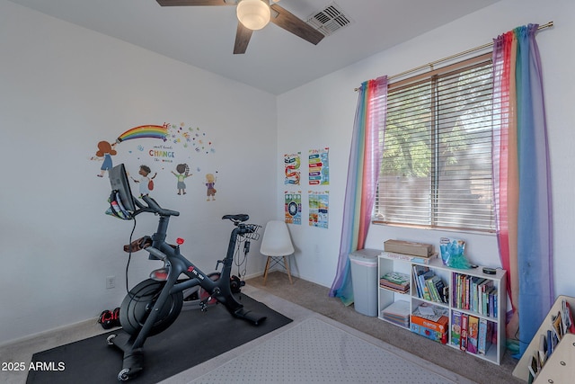 workout room featuring carpet flooring, ceiling fan, and visible vents
