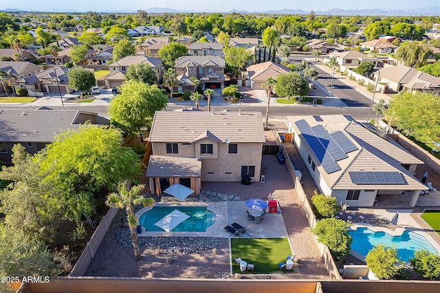 birds eye view of property with a residential view