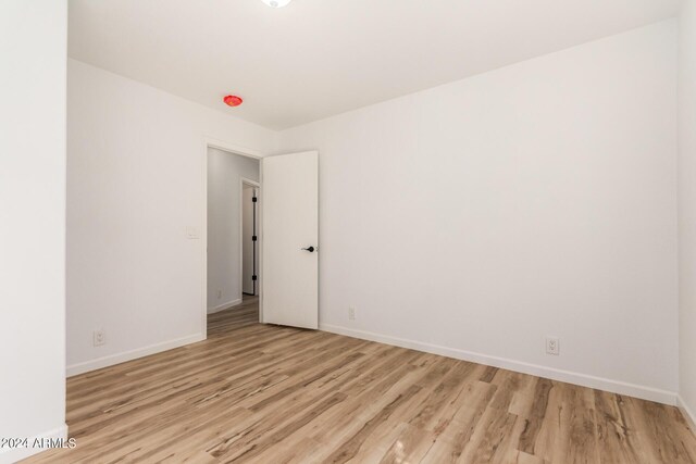 spare room featuring light hardwood / wood-style flooring