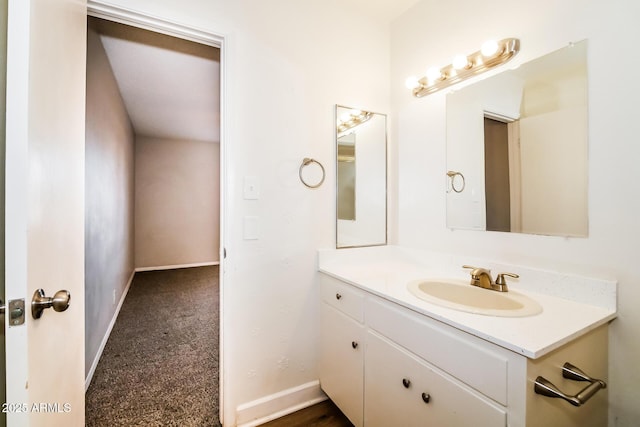 bathroom with baseboards and vanity