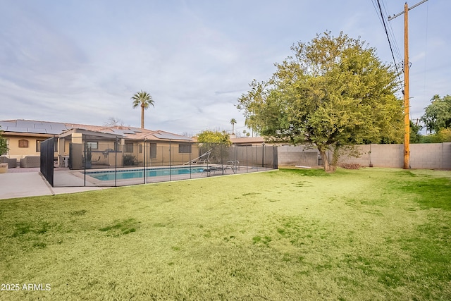 view of yard with a fenced in pool and a patio area