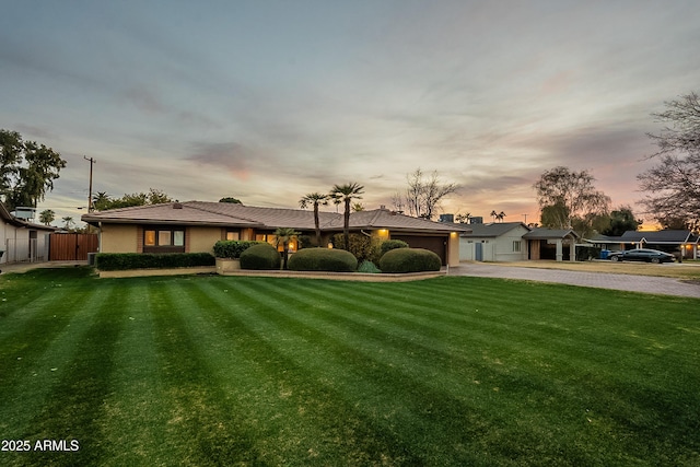 view of front of property with a lawn