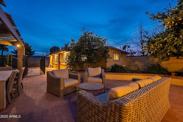 patio terrace at dusk with an outdoor living space