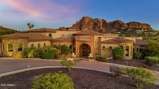 mediterranean / spanish-style house featuring a mountain view