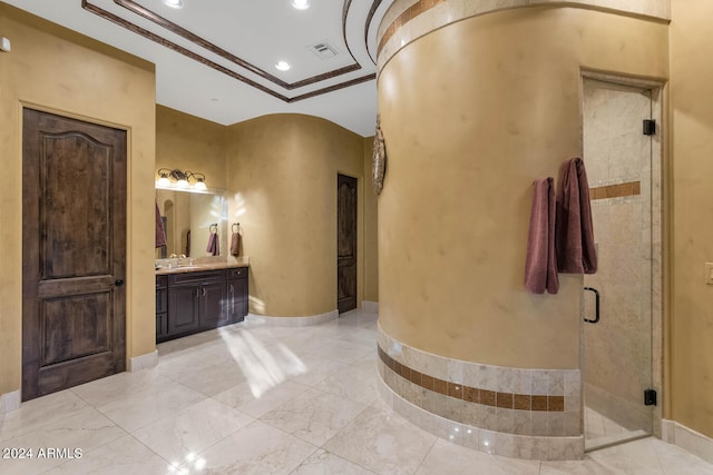 bathroom with walk in shower, vanity, and ornamental molding