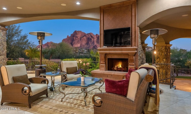 view of patio featuring exterior fireplace