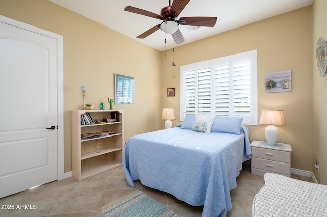 bedroom featuring ceiling fan and light tile patterned floors