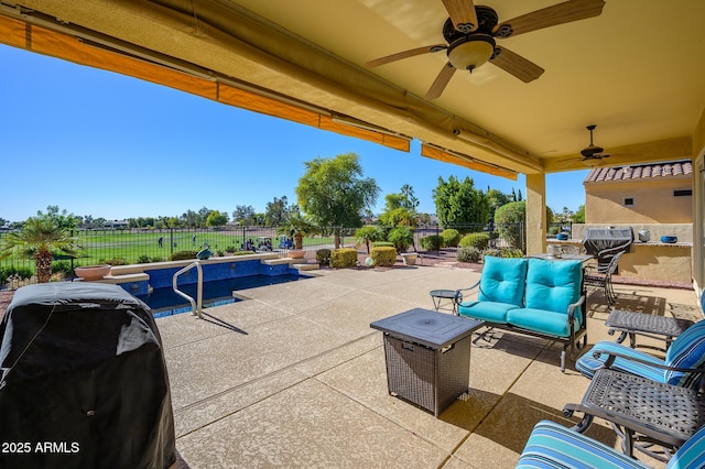 view of patio featuring ceiling fan, a grill, and an outdoor hangout area