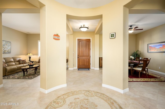 foyer featuring ceiling fan