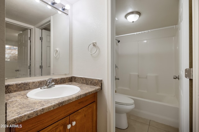 full bathroom with shower / bathing tub combination, tile patterned flooring, vanity, and toilet