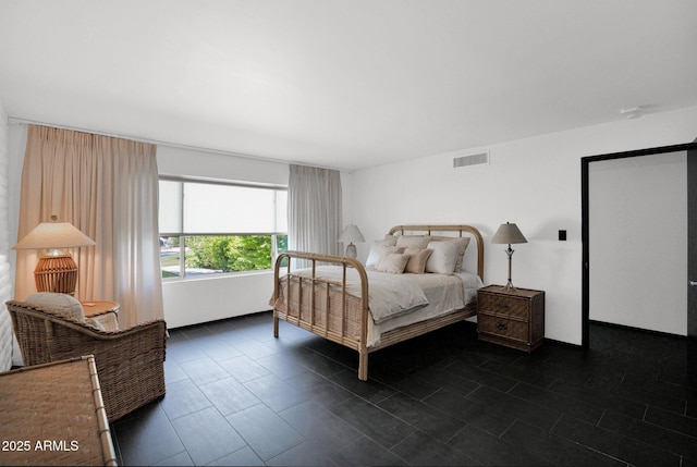 4800 N 68th St Unit 101, Scottsdale, AZ 85251 - bedroom featuring dark tile patterned flooring