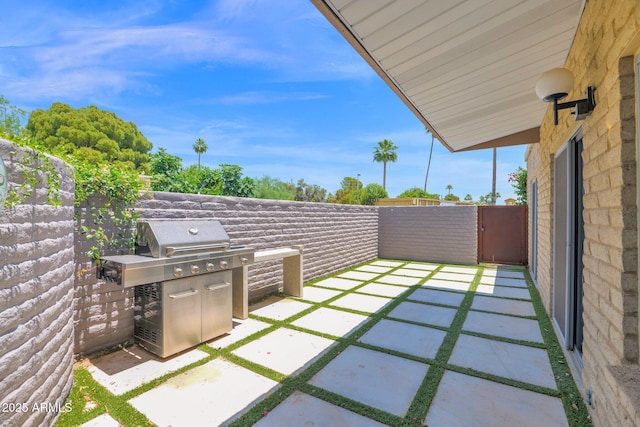4800 N 68th St Unit 101, Scottsdale, AZ 85251 - fenced backyard with area for grilling and a patio area