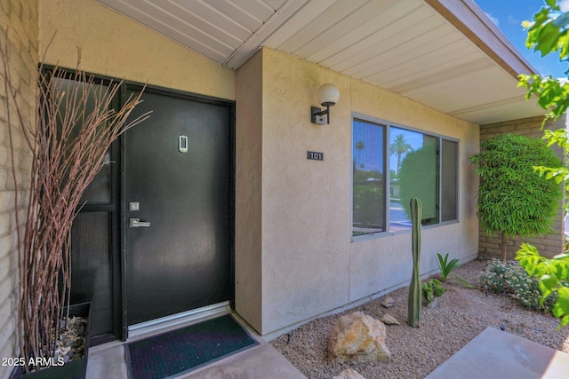 4800 N 68th St Unit 101, Scottsdale, AZ 85251 - doorway to property with stucco siding