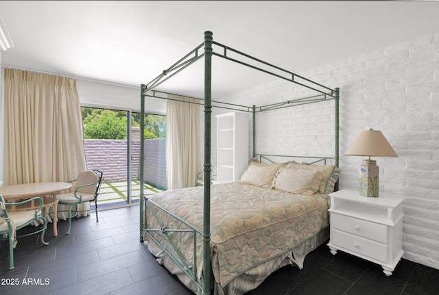 4800 N 68th St Unit 101, Scottsdale, AZ 85251 - bedroom with access to outside and dark tile patterned floors