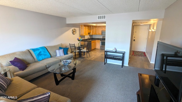 carpeted living room with sink